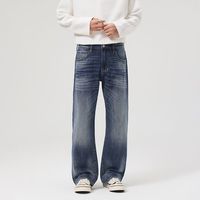 Jean large bleu foncé en denim délavé, coupe ample, taille mi-haute, style streetwear décontracté