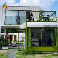 Maisons conteneurs modernes personnalisées, tendance et réputées, à deux étages, pour magasin, hôtel, restaurant, bureau, ou bâtiment commercial avec vue sur la rue