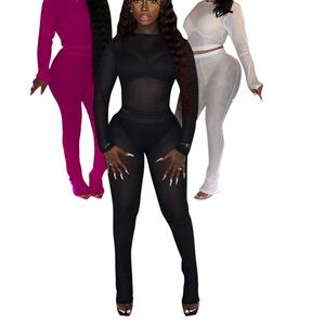 Top a maniche lunghe in rete trasparente e pantaloni lunghi, completo casual da donna in due pezzi - Product Image 1