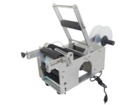 Machine d'étiquetage semi-automatique MT-50 pour bouteilles rondes, idéale pour l'étiquetage des autocollants.