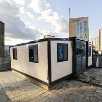 Maison préfabriquée en acier moderne de luxe, 20 pieds/40 pieds, isolée, respirante, conteneur portable, extensible, boutique prête à l'emploi, installation rapide