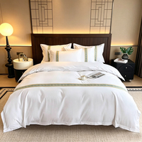 Parure de lit 4 pièces en coton 100% brodé blanc pur, style simple, pour hôtel 5 étoiles et gîte, comprenant housse de couette et drap.