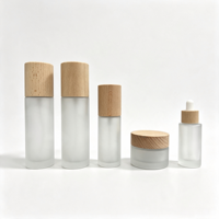 Flacon de lotion en verre écologique de 15g, 30g, 50g, 100ml, 120ml avec bouchon en bois de bambou naturel pour l'emballage de produits de beauté