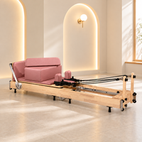 Reformer Pilates pliable en chêne commercial pour studio entraînement du tronc et gain de place