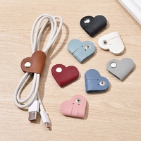 Organisateur de câbles mignon en forme de mini-cœur, support portable en cuir PU pour écouteurs, accessoire de fixation de câbles en gros pour usage quotidien