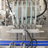 Machine de remplissage automatique par gravité PLC à 4 buses pour bouteilles en verre, boissons, produits chimiques, huile, poudre, fûts et emballages métalliques – Garantie 1 an