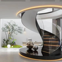 Escalier flottant incurvé en acier inoxydable avec garde-corps en verre sans cadre, design moderne pour usage extérieur