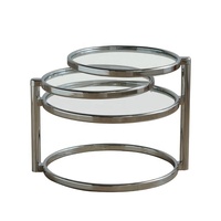 Table basse gigogne à 3 niveaux avec plateau en verre trempé transparent, structure rotative en acier inoxydable poli, design moderne et minimaliste pour le salon