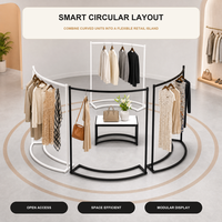 Porte-vêtements en îlot avec support au sol en forme d'arc pour l'affichage central en magasin de vêtements et la présentation de la mode