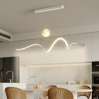 Nouvelle lampe de salle à manger et lustre de table à manger, moderne et simple, de style italien minimaliste, créative et personnalisée, avec un motif de lune