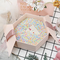 Boîte à rouge à lèvres et parfum rigide en papier recyclable personnalisée directement de l'usine, emballage cadeau créatif avec nœud et fleur, revêtement UV durable