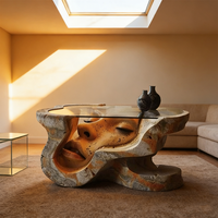 Table basse artistique, sculpture irrégulière, table d'appoint, table basse, verre, fabrication artisanale, design unique, statue de visage humain, mobilier de salon