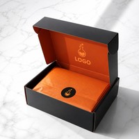 Boîte d'expédition personnalisée noire et orange, imprimée recto-verso, idéale pour le transport de vêtements de marque