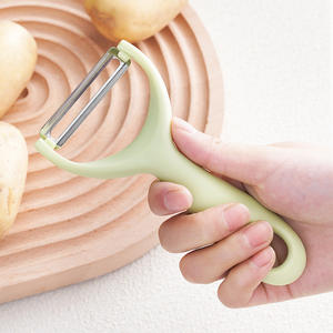 Pelador multifunción de acero inoxidable de Yiwu para frutas y verduras con mango de plástico, solo lavar a mano. - Product Image 1