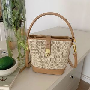 Bolso tipo cubo de paja tejida, color albaricoque, dureza media, cierre con cremallera, bolso cruzado para atuendos diarios, verano 2023 - Product Image 1