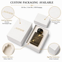 Flacon de parfum carré de luxe avec bouteille en verre gris fumé et feuille d'or, bouchon texturé effet roche pour parfum haut de gamme