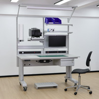 Banc de travail motorisé ESD robuste conçu pour l'assemblage industriel avec réglage de hauteur programmable et design ergonomique