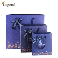 Sacs en papier cadeau floraux en gros avec nœud en ruban, sacs en papier personnalisés avec logo imprimé pour emballage de cadeaux de mariage et d'anniversaire
