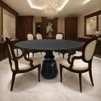 Table à manger ronde en marbre noir de luxe avec base sculpturale artisanale pour une élégance intérieure et extérieure