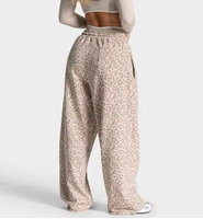 Pantalon de jogging large personnalisé avec étiquette imprimée et passepoil léopard noir, en coton respirant pour femme