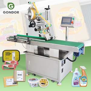 Système d'étiquetage automatique pour sacs plats avec alimentateur, pour étiquettes transparentes sur le dessus, le côté, la tête et le bas - Product Image 1