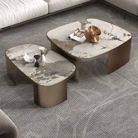 Le fabricant fournit des ensembles de tables basses rondes créatives en pierre de roche simples et modernes de style luxe léger pour salon de petite taille