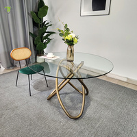 Ensemble table et chaises de salle à manger en ardoise moderne Table de salle à manger ronde en verre transparent à structure en métal doré de luxe