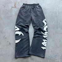 Pantalon de survêtement personnalisé avec patch brodé vintage, 100% coton, 360 g/m², en molleton bouclette, taille élastique, coupe ample, avec appliqué, délavé à l'acide, évasé