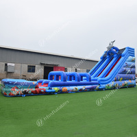 Parc aquatique gonflable géant avec toboggan en forme de dauphin |   Piscine gonflable géante pour adultes avec toboggan, idéale pour les fêtes estivales en location