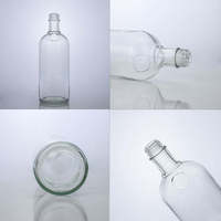 Bottiglia di Vetro Trasparente Rotonda per Liquori da 700ml 750ml con Chiusura a Vite, Personalizzabile all'Ingrosso