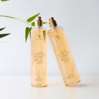 Échantillon et bouteille transparente en plastique de 250ml de forme ronde de style luxueux avec pulvérisateur doré pour cosmétiques