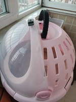 Lit rond pour chat portable et innovant avec coussin amovible lavable et poignée de transport confortable pour les voyages en intérieur et en extérieur