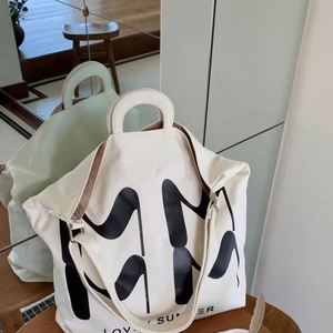 Sac bandoulière en toile grande capacité, double compartiment, personnalisable avec logo et lettres imprimées, élégant et polyvalent - Product Image 1