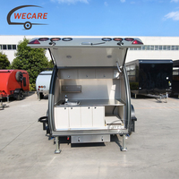 Roulotte de camping autonome Wecare avec cuisine extérieure, remorquable par SUV pour le camping hors réseau