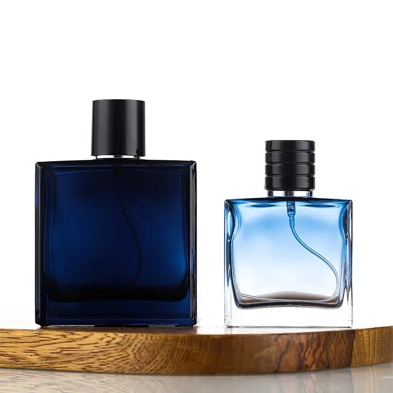 डिज़ाइन 50 मिली 100 मिली स्किनकेयर कोलोन बोतल गहरा नीला साफ़ ग्रेडिएंट कलर ग्लास परफ्यूम बोतल काले ढक्कन के साथ