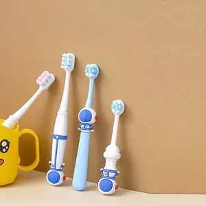 Brosse à dents super douce pour enfants en forme d'astronaute Brosse à dents pour enfants de couleur personnalisée Brosse à dents à poils souples pour enfants de ménage