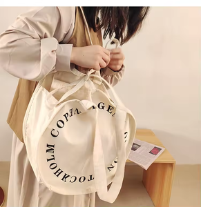 Sac fourre-tout <span class=keywords><strong>en</strong></span> toile de coton <span class=keywords><strong>en</strong></span> gros, rond, durable, <span class=keywords><strong>tissu</strong></span> lourd de 16 onces, sac fourre-tout personnalisé <span class=keywords><strong>en</strong></span> toile ronde avec votre logo - Product Image 4