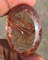 Pierre précieuse ovale facettée en quartz rutilé rouge naturel de qualité supérieure, réservée pour la fabrication de bijoux par des professionnels
