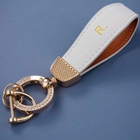 Nouveau porte-clés coloré, simple et écologique en alliage de zinc et cuir PU pour voiture, anti-perte, accessoires haut de gamme, vente en gros
