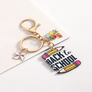 Porte-clés solaire en métal personnalisé et tendance, motif dessin animé, pour la Fête des Enseignants, avec crayon et carnet, idéal comme cadeau pour amis et pour sac à dos scolaire - Product Image 6