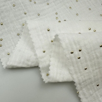 Tissu en coton biologique double crêpe imprimé à motifs croisés pour bébés et enfants