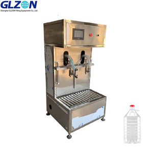 Machine <span class=keywords><strong>semi</strong></span>-automatique de pesage et de remplissage de bouteilles d'huile de haute précision à double tête - Product Image 1