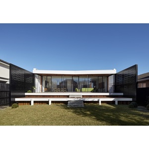 Villa moderna de acero con paredes de vidrio y paneles perforados para uso residencial - Product Image 1