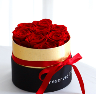 Scatola rotonda con 6 rose
