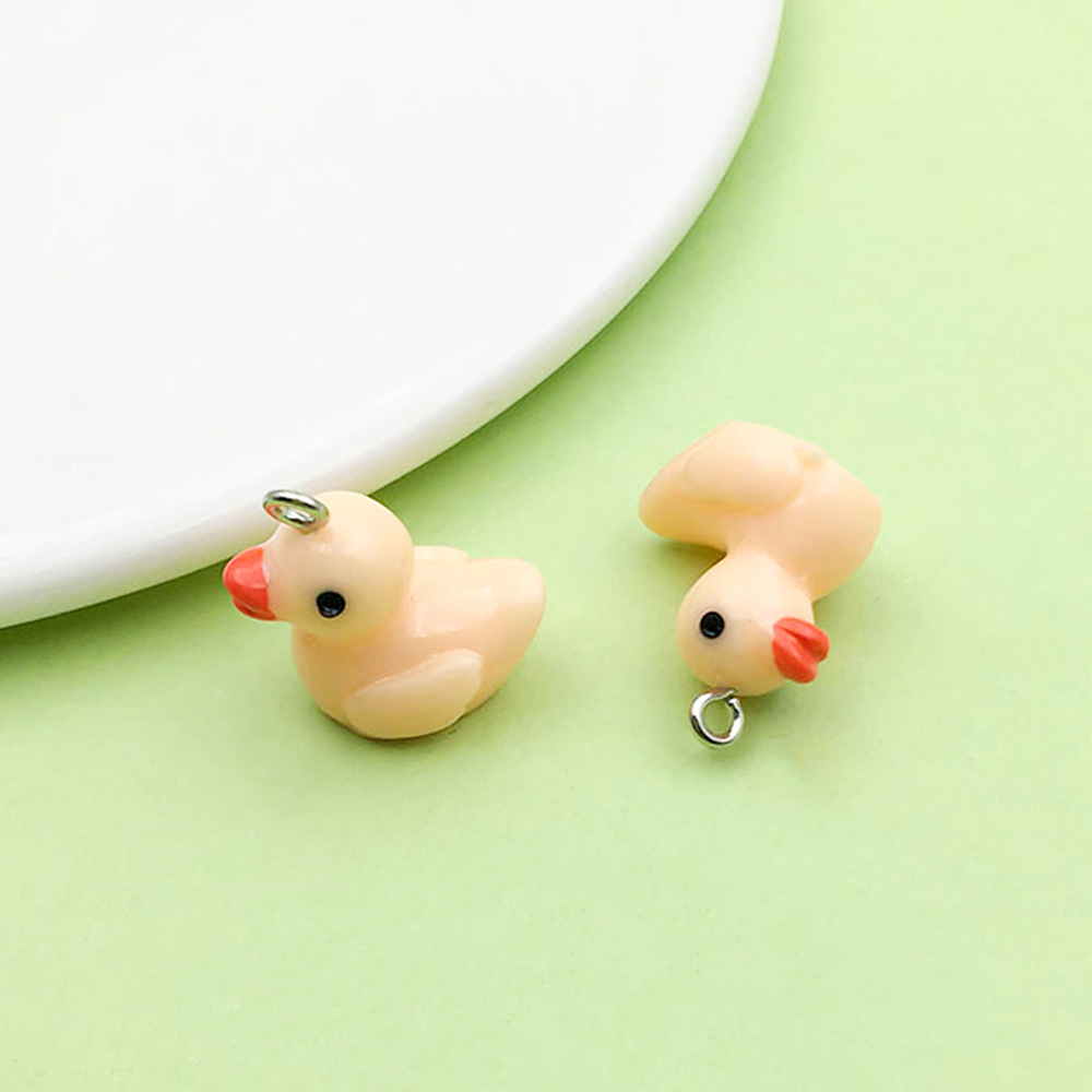 Un patito de resina naranja, 17*19 mm, 1,9 g, 17219 g.