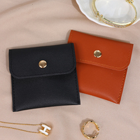 Nouveaux articles fermeture à pression bijoux organisateur sac anneaux boucles d'oreilles personnalisable Mini pochette en cuir PU parfait pour les petits accessoires