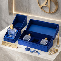 Boîte cadeau rigide bleue de luxe sur mesure avec insert en satin/velours pour emballage de parfums et cosmétiques haut de gamme