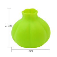 Accessoire de cuisine domestique efficace: éplucheur d'ail rond en silicone de qualité