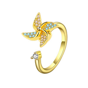 Anillos giratorios con diseño de molino de viento, ajustables, con microincrustaciones de circonita azul y rosa, chapados en oro sobre cobre, joyería para aliviar la ansiedad para niñas - Product Image 1