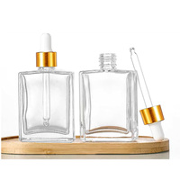 Flacon compte-gouttes en verre transparent de 50 ml (1,7 oz) pour sérum, huile essentielle, soin du visage et du corps, avec compte-gouttes doré